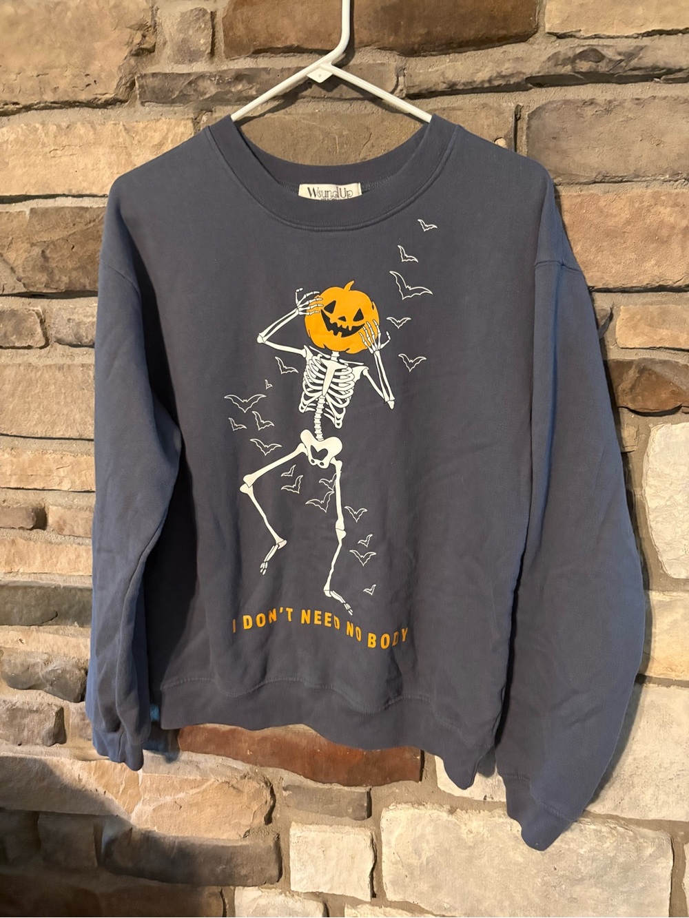 Wound Up Gray Crewneck Sweater with Orange Pumpkin Skeleton Graphic